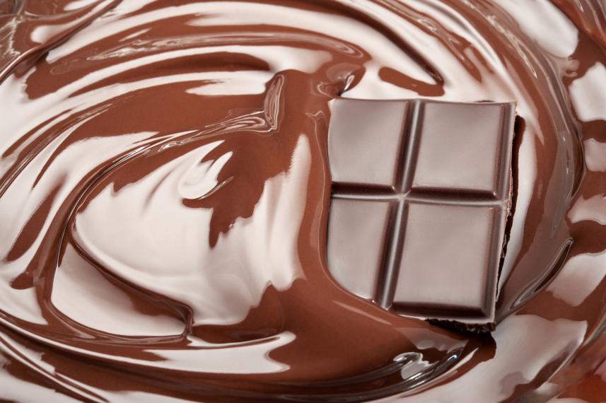 Chocolate bar melting into liquid chocolate